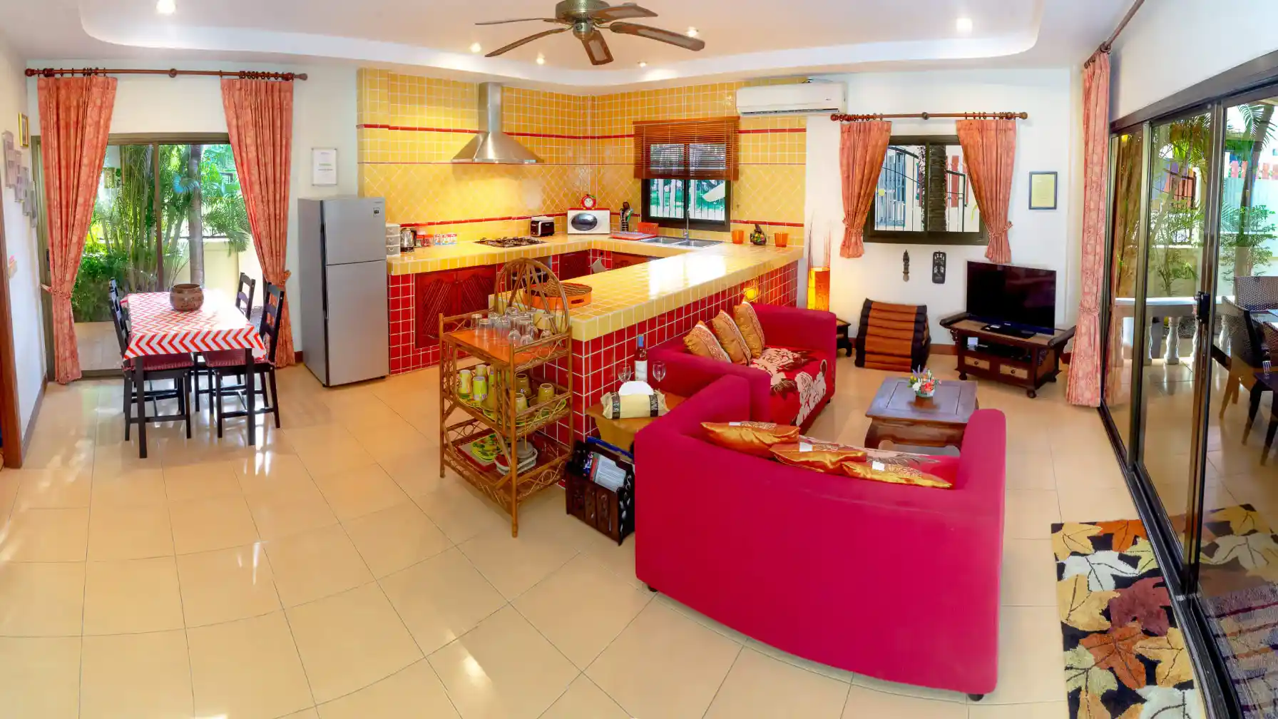Bon Island Villa open-plan living, dining and kitchen with air conditioning and ceiling fan