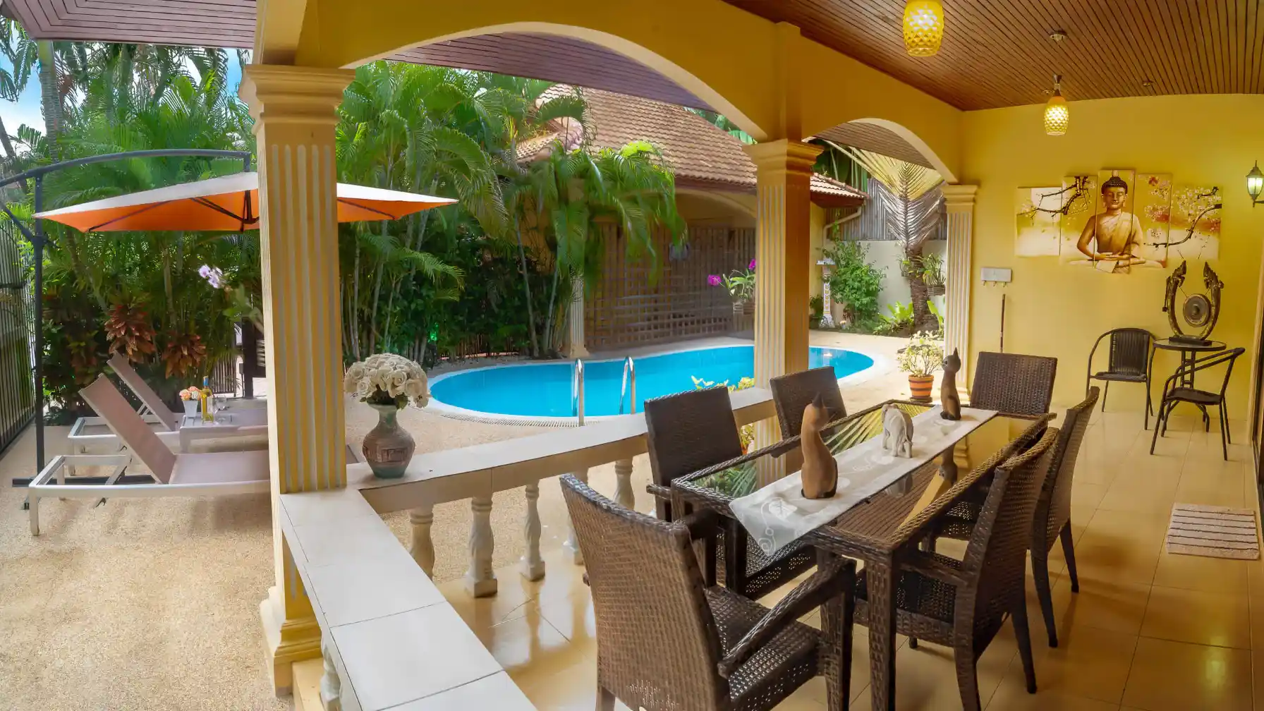 Bon Island Villa outdoor dining patio with six-seat table and pool beyond