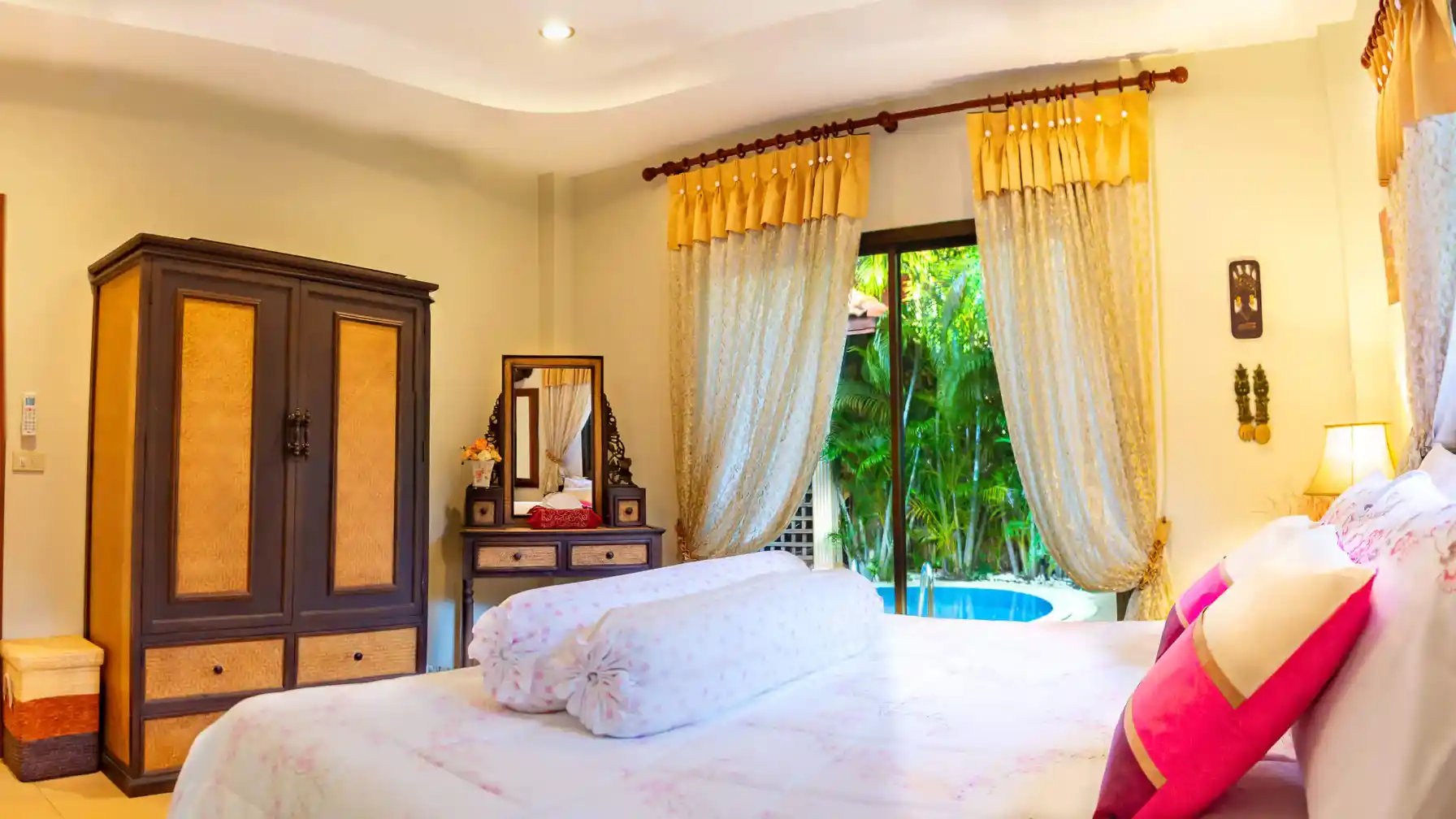 Coral Island Villa master bedroom with air conditioning and garden views