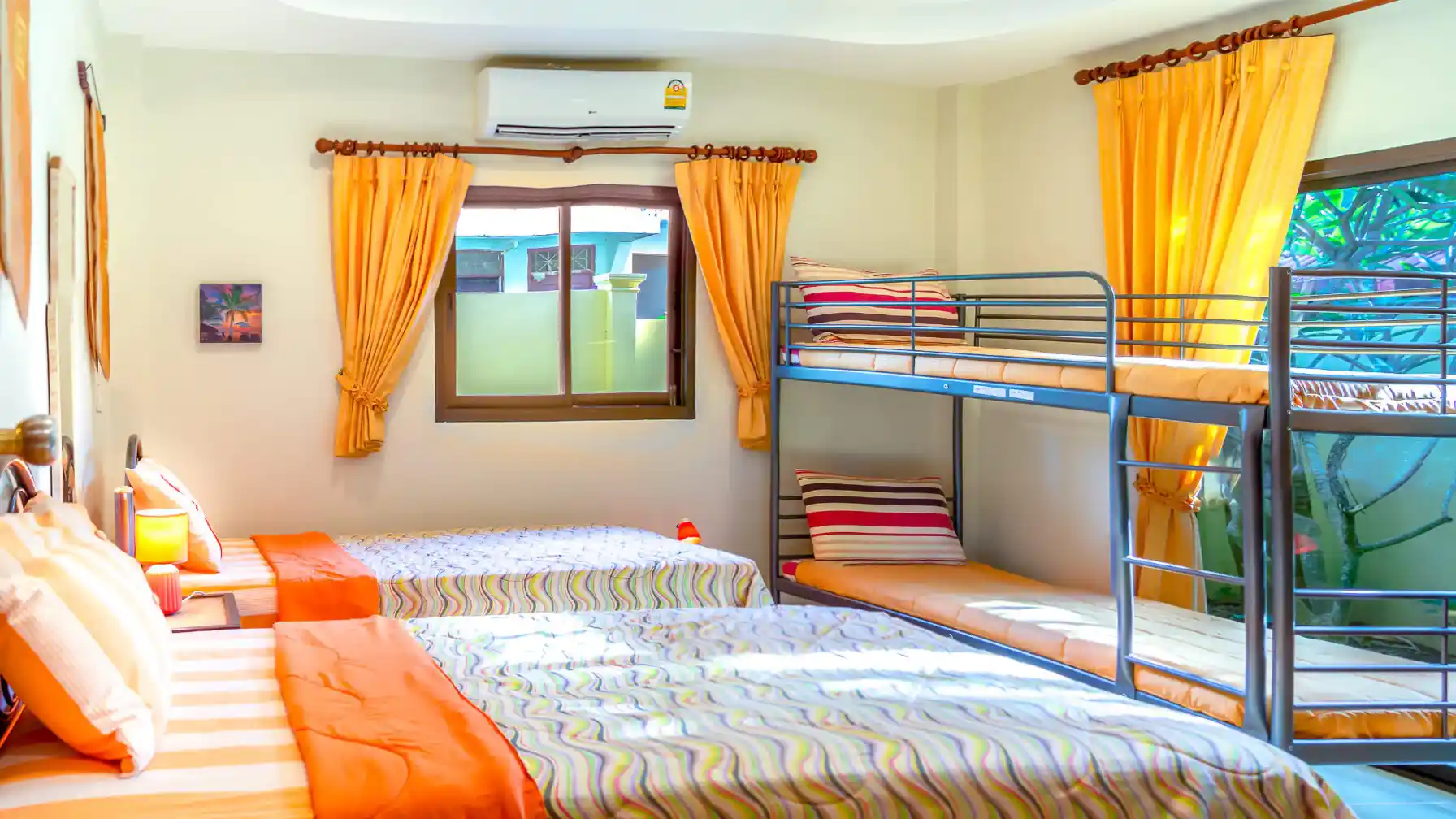 Coral Island Villa second bedroom with bunk beds and single bed, air conditioning