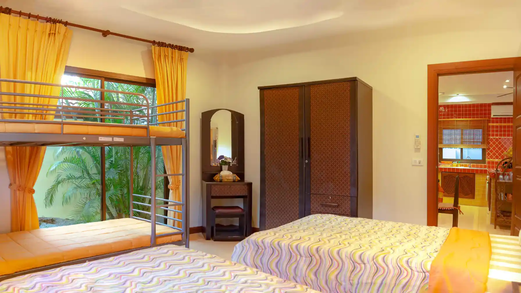 Coral Island Villa second bedroom sleeping area with wardrobe